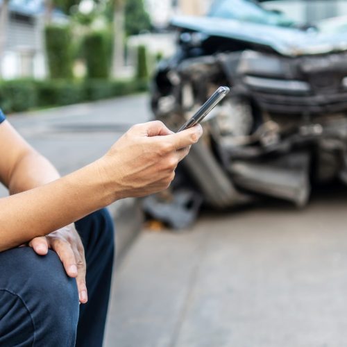 Man,Calling,With,Phone,To,His,Insurance,Agent,After,Traffic